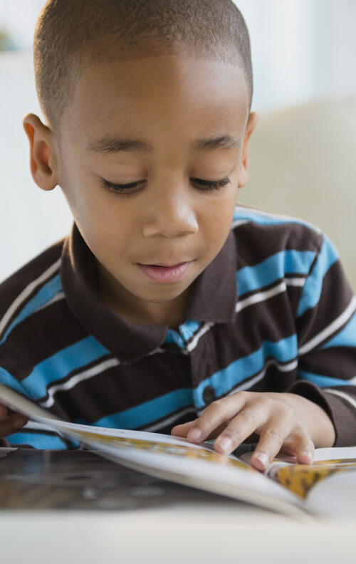 Boy Reading - NHIDA Outreach